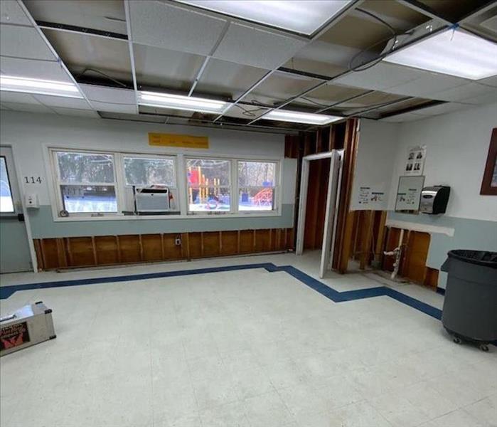 Classroom with flood cuts around floor joints with wall cavities exposed