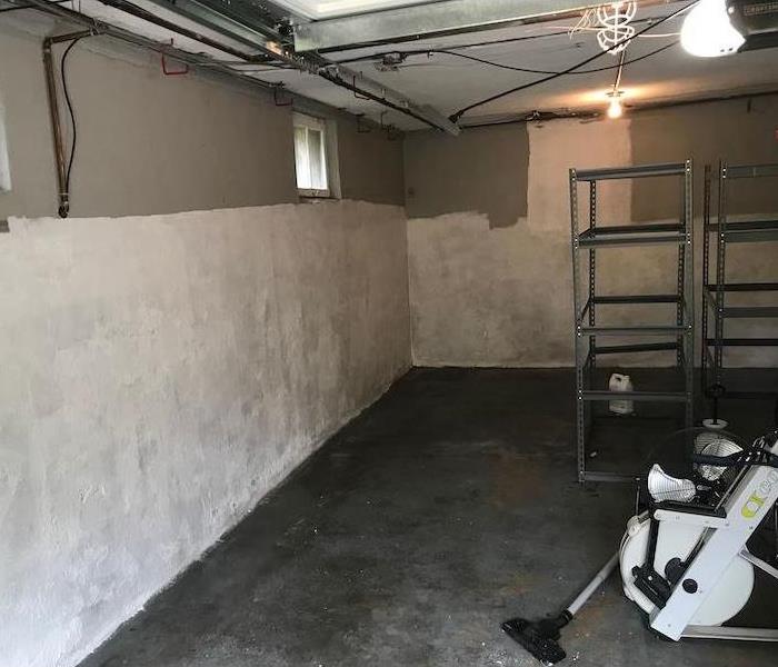 Basement wall with antimicrobial sealant and clean floor