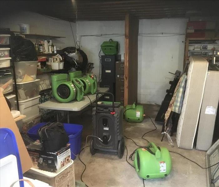 air movers and dehumidifiers drying out basement