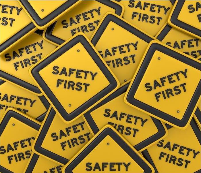 'safety first' signs on top of each other